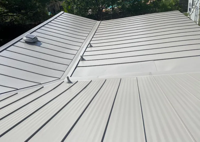Solar attic fan installed on a metal roof for Roof Ventilation in Eufaula